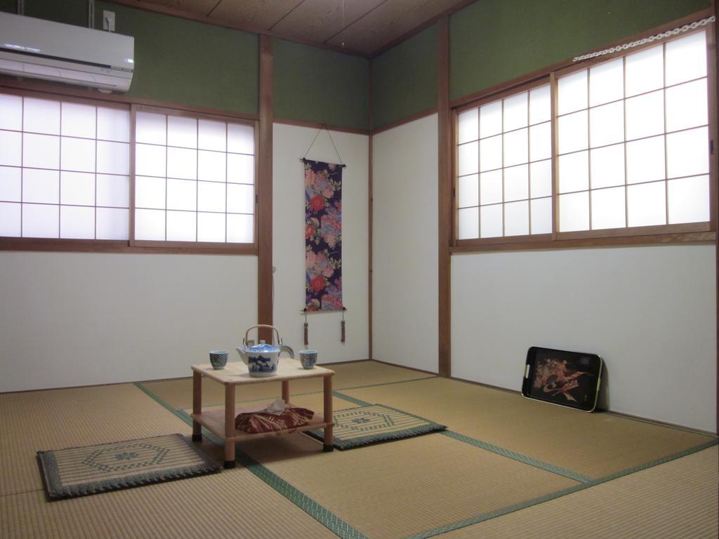 Enman Guest House Osaka Moriguchi Bagian luar foto